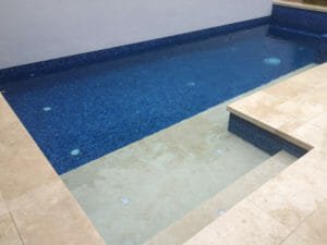 ivory travertine unfilled and tumbled pool pavers and pool coping tiles
