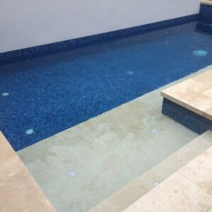 ivory travertine unfilled and tumbled pool pavers and pool coping tiles