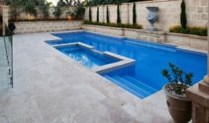 ivory travertine unfilled and tumbled pool pavers and pool coping tiles