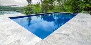 silver travertine unfilled and tumbled pool coping and pavers