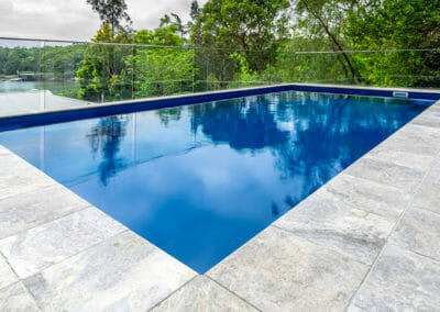 silver travertine unfilled and tumbled pool coping and pavers
