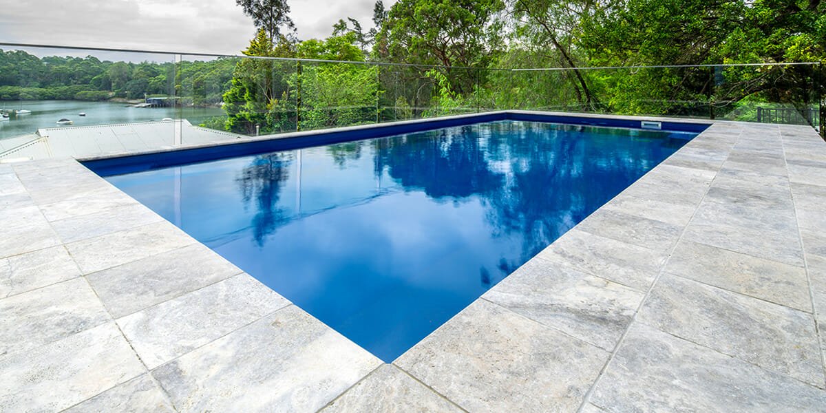 silver travertine unfilled and tumbled pool coping and pavers